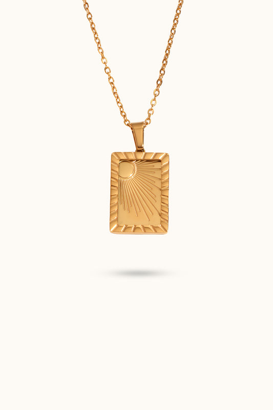 Carved sun-shaped plaque necklace